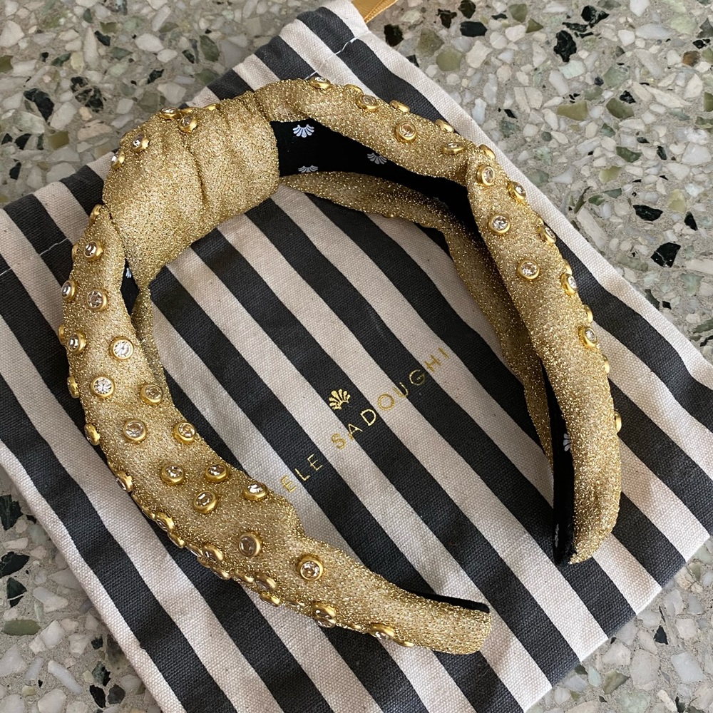 Never worn Lele Sadoughi knotted headband in glittery gold fabric with jewels
